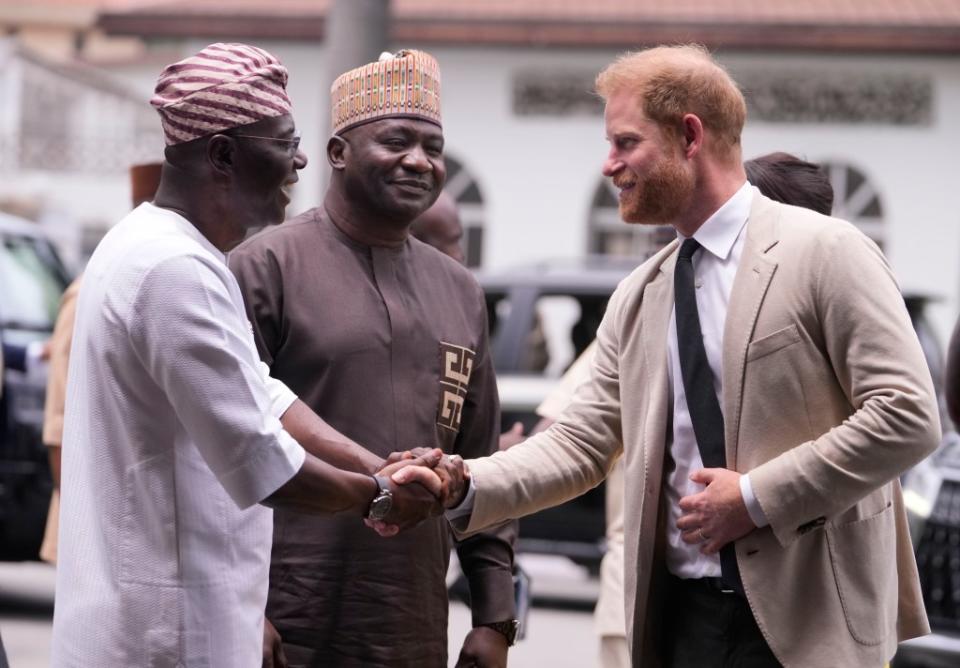 Prince Harry shaking hands in Nigeria on May 12, 2024. AP