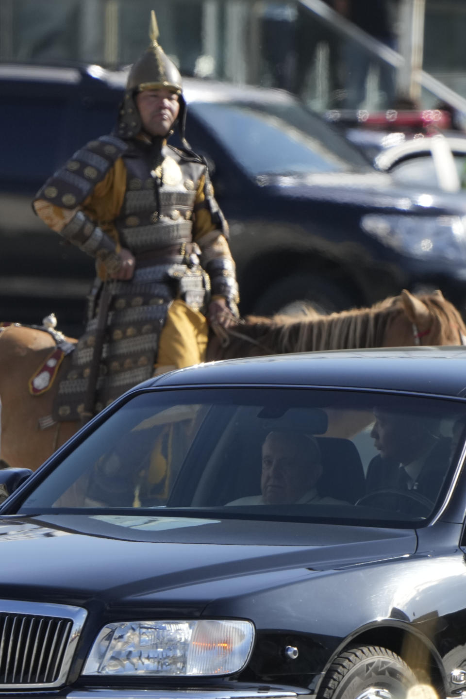 Pope Francis arrives in a car to meet with Mongolian President Ukhnaagin Khurelsukh, Saturday, Sept. 2, 2023, in Sukhbaatar Square in Ulaanbaatar. Pope Francis arrived in Mongolia on Friday morning for a four-day visit to encourage one of the world's smallest and newest Catholic communities. (AP Photo/Ng Han Guan)