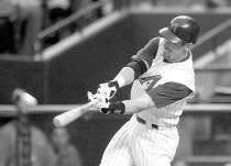 Arizona outfielder Luis Gonzalez connects for a two-run home run off New York starter James Baldwin in the first inning Monday. Gonzalez hit another homer off Baldwin in the third and added a third home run in the fourth inning of the Diamondbacks\' 12-8 win over the Mets at Bank One Ballpark in Phoenix. AP Photo.