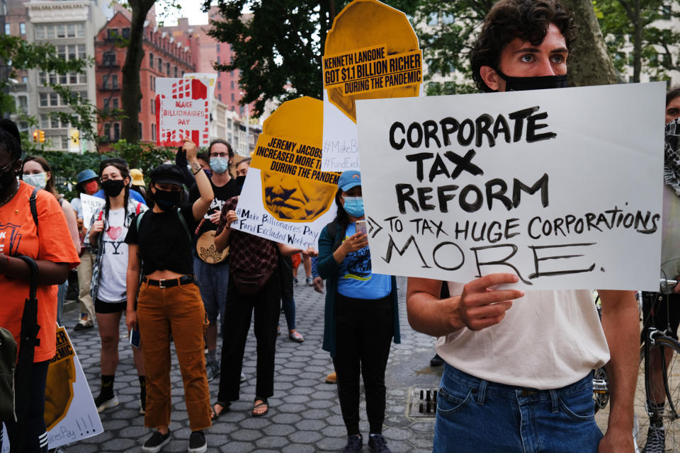 People participate in a "March on Billionaires" event on July 17 in New York City. The march called on Governor Andrew Cuomo to pass a tax on billionaires and to fund workers excluded from unemployment and federal aid programs<span class="copyright">Spencer Platt—Getty Images</span>