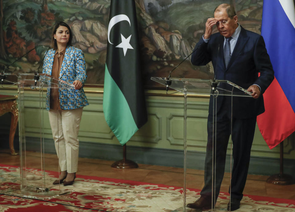 Russian Foreign Minister Sergey and Libyan Foreign Minister Najla Mangoush attend a joint news conference following their talks in Moscow, Russia, Thursday, Aug. 19, 2021. (Maxim Shipenkov/Pool Photo via AP)