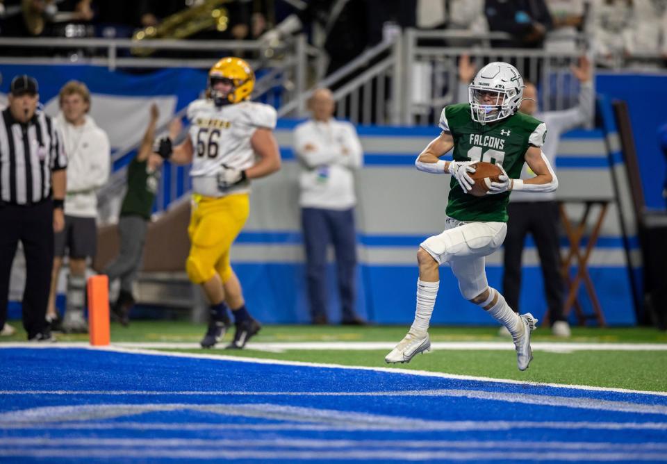 Grand Rapids West Catholic's Carter Perry scores a touchdown during the first half of West Catholic's 59-14 win in the Division 6 state finals on Friday, Nov. 25, 2022, at Ford Field.