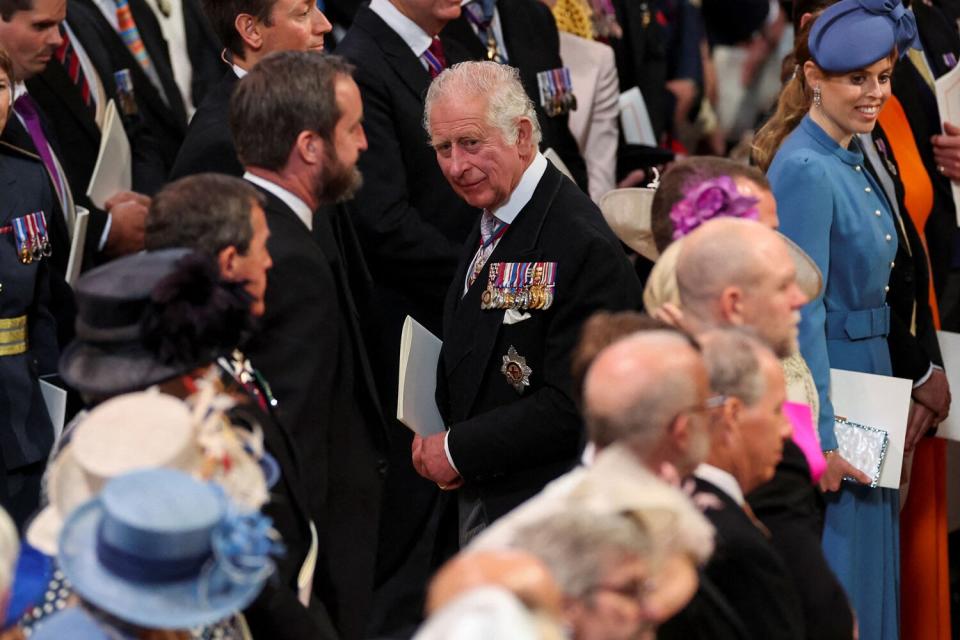 Prince Charles, Prince of Wales, (C) leaves at the end of the National Service of Thanksgiving for The Queen's reign at Saint Paul's Cathedral