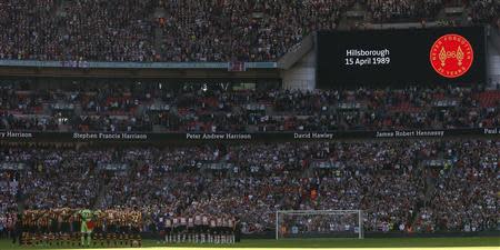 Hull City and Sheffield United stand for a minute's silence in memory of the Hillsborough disaster victims before their English FA Cup semi-final soccer match against Sheffield United at Wembley Stadium in London, April 13, 2014. The disaster in which 96 people lost their lives occurred on April 15, 1989. REUTERS/Stefan Wermuth