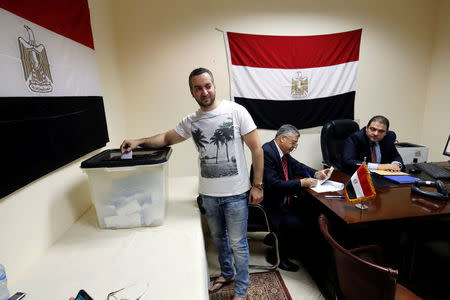 An Egyptian living in Sudan casts his vote at the Egypt Embassy in Khartoum, Sudan March 16, 2018. REUTERS/Mohamed Nureldin Abdallah