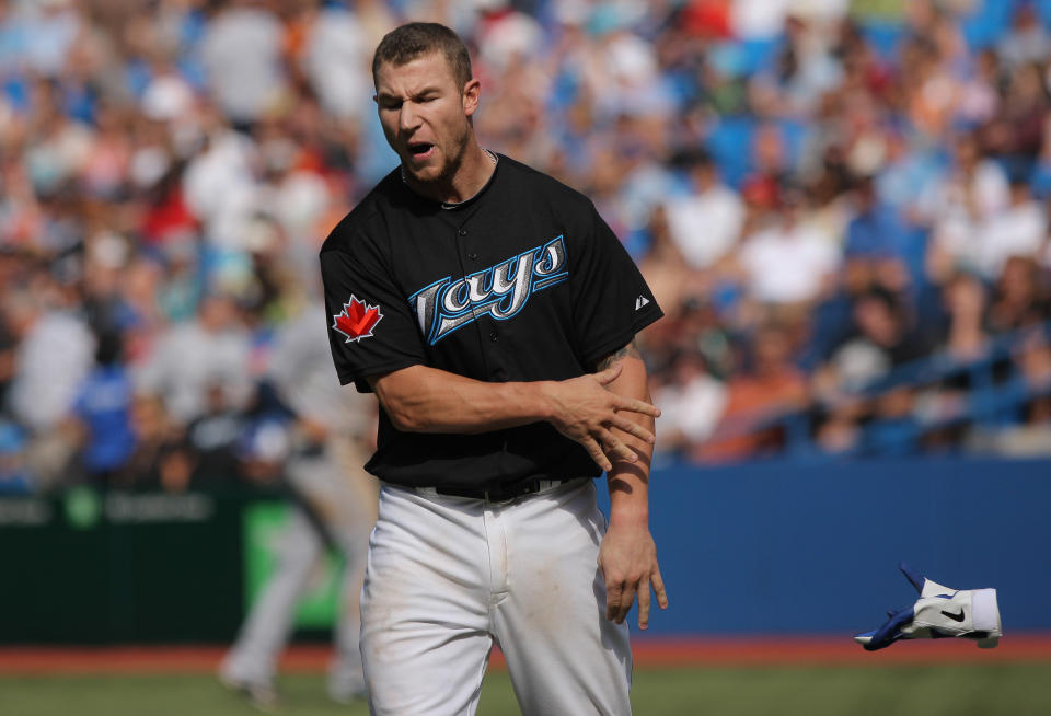 TORONTO, CANADA - AUGUST 27: Brett Lawrie #13 of the Toronto Blue Jays reacts after fouling out to end the 8th inning during MLB game action against the Tampa Bay Rays on August 27, 2011 at Rogers Centre in Toronto, Ontario, Canada. (Photo by Tom Szczerbowski/Getty Images)