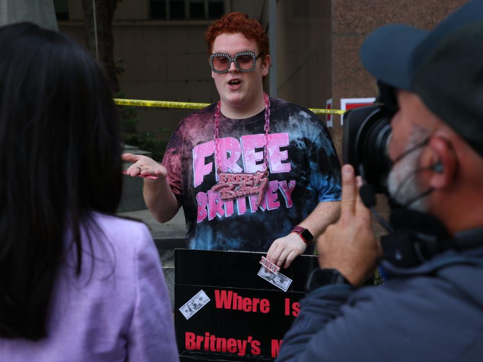 Fans of Britney Spears speak to the media at the Los Angeles County Courthouse.