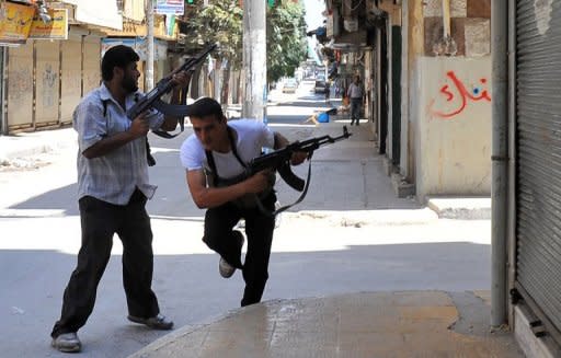 Fighters from the Syrian opposition clash with forces loyal to President Bashar al-Assad, in the center of Syria's restive northern city of Aleppo on July 25. Syrian troops and rebels sent reinforcements to the intensifying battle in the second city Aleppo, as the US said fresh defections from the regime showed Assad's "days are numbered"