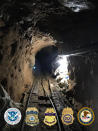 This photo released Tuesday, March 31 2020, by the San Diego Tunnel Task Force, Department of Homeland Security, shows a rail system in a cross-border tunnel running from warehouses in Tijuana, Mexico to San Diego. U.S. authorities seized a large haul of drugs including opioids, methamphetamine and cocaine, being smuggled through the tunnel equipped with ventilation, lighting and an underground rail system. Authorities believe it existed for several months. (San Diego Tunnel Task Force/Department of Homeland Security via AP)