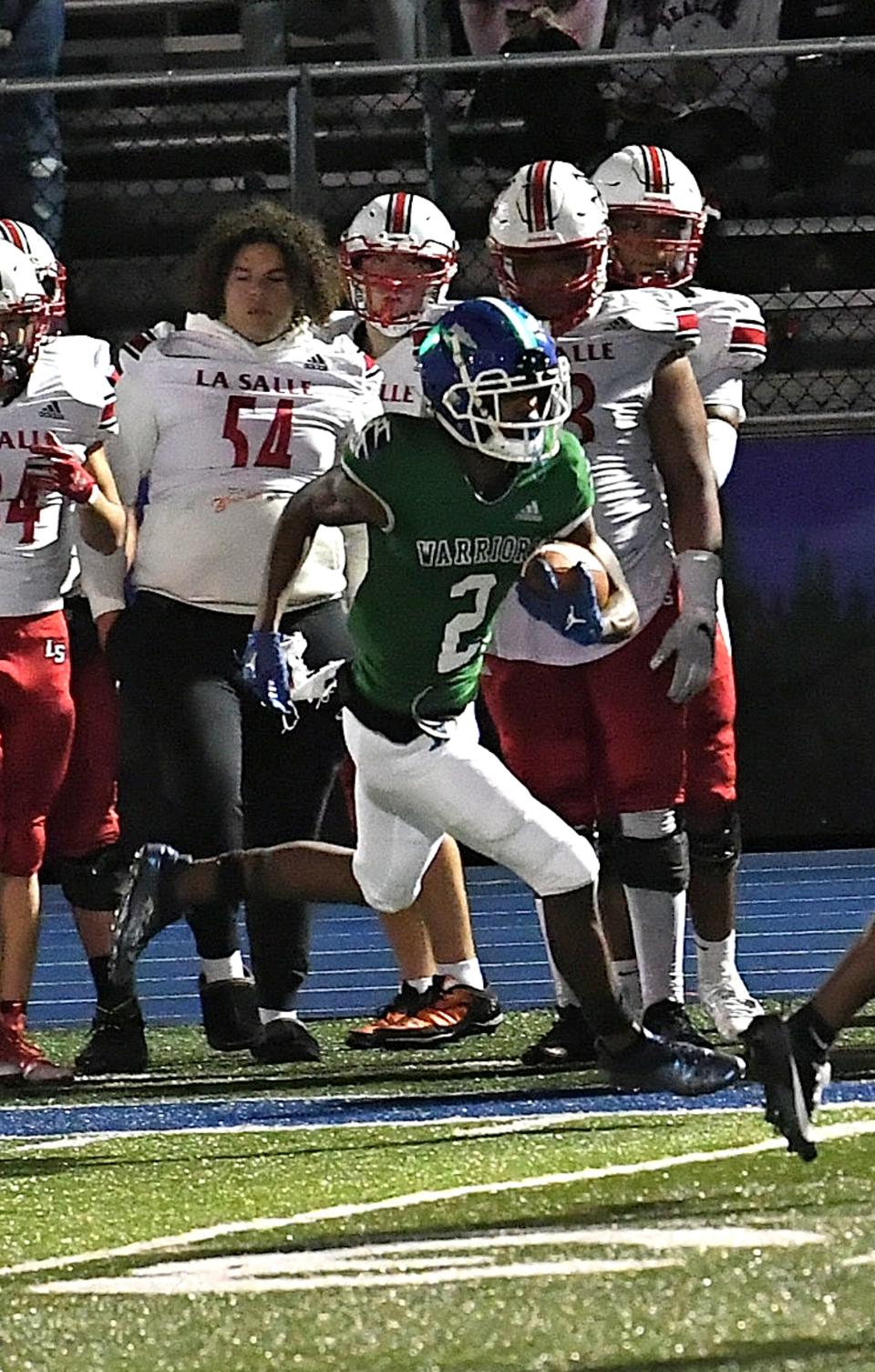 Charles Johnson (2) speeds down the sidelines for Winton Woods setting up the Warriors for a go-ahead score in OHSAA Division II, round one, playoff football at Winton Woods High School, Oct. 27, 2023.