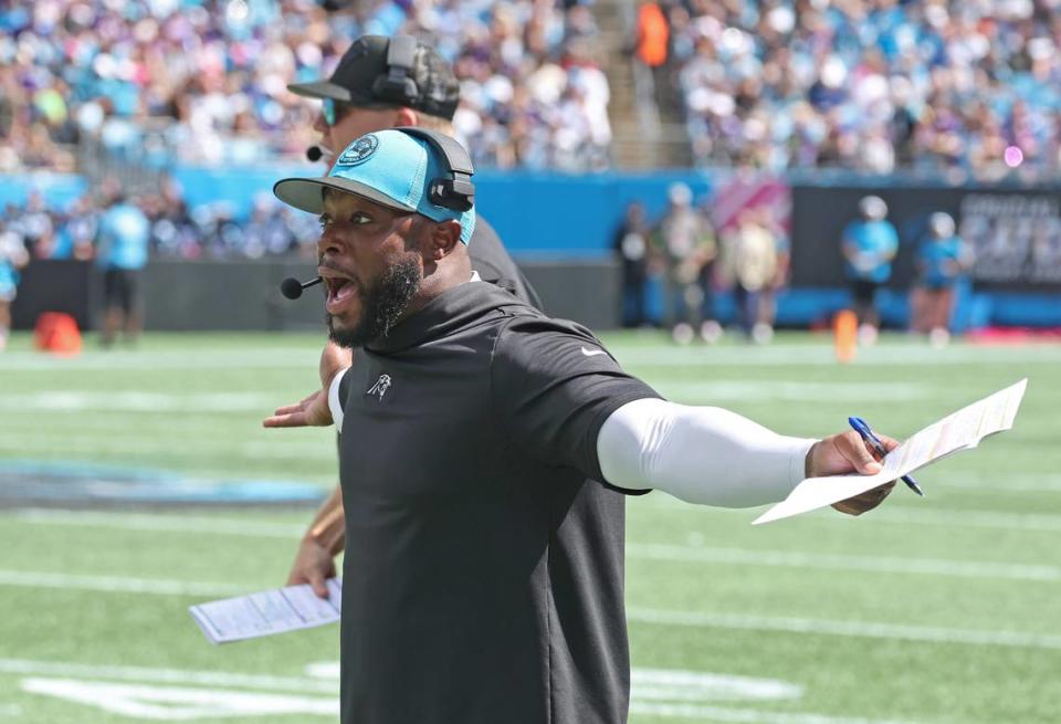 Members of the Carolina Panthers coaching staff react to quarterback Bryce Young being hit and knocked to the turf by Minnesota Vikings linebacker Jordan Hicks on a play that had been blown dead during first-quarter action at Bank of America Stadium on Sunday, October 1, 2023. The Minnesota Vikings defeated the Panthers 21-13.