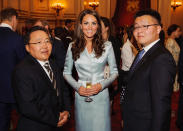 This pale blue blazer dress is an easy way to combine business with evening wear. <br>--<br> Catherine, Duchess of Cambridge poses with President of Mongolia Elbegdorj Tsakhia (L) during a reception at Buckingham Palace a reception for Heads of State and Government attending the Olympics Opening Ceremony on July 27, 2012 in London, England.