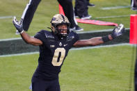 Purdue wide receiver Milton Wright (0) celebrates a touchdown by Purdue wide receiver David Bell (3) during the fourth quarter of an NCAA college football game against Iowa in West Lafayette, Ind., Saturday, Oct. 24, 2020. Purdue defeated Iowa 24-20. (AP Photo/Michael Conroy)