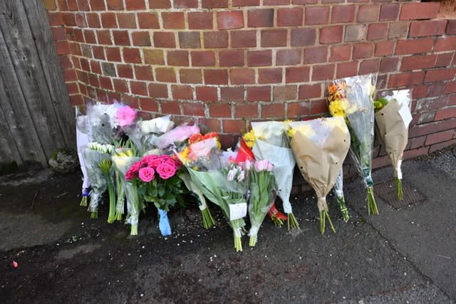 Floral tributes left outside 109 Cowick Lane, Exeter, where the bodies of twins Dick and Roger Carter were discovered 