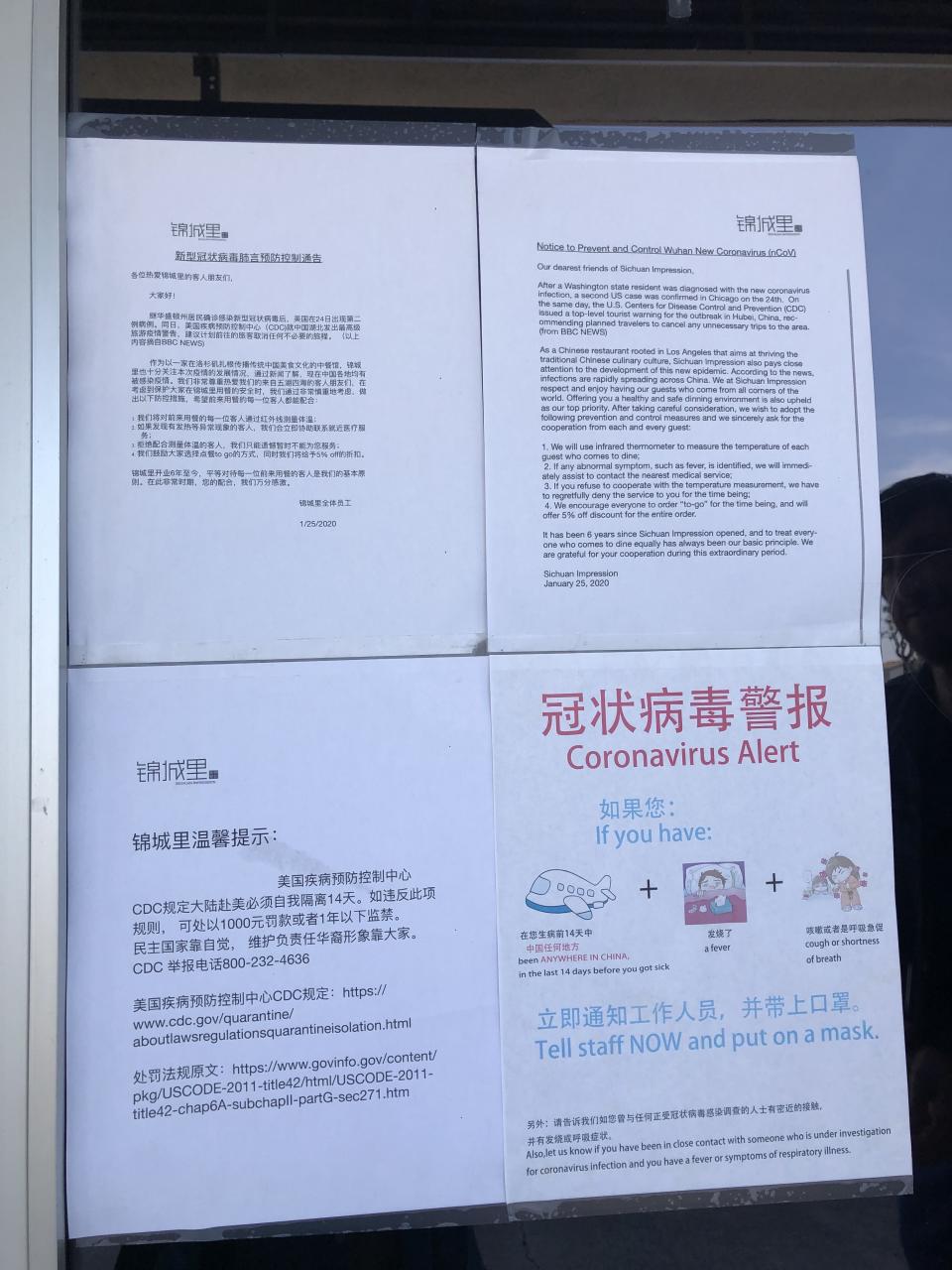 A coronavirus warning sign posted in the window of Sichuan Impression in Tustin, California (Kat De Angelis)