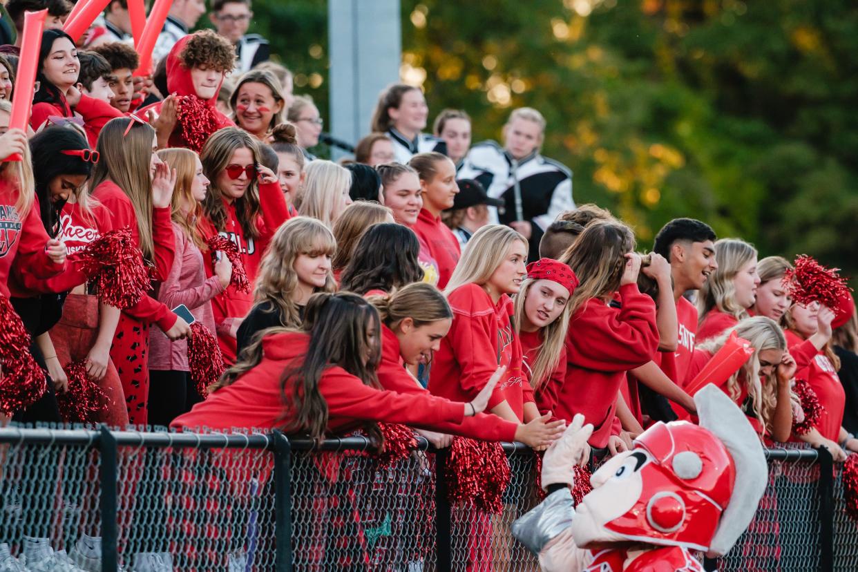 Tusky Valley student-fans socialize and interact with the Trojan, the TV macot, during week 6 high school football action against Ridgewood, Friday, Sept. 22, at Tusky Valley High School in Mineral City.