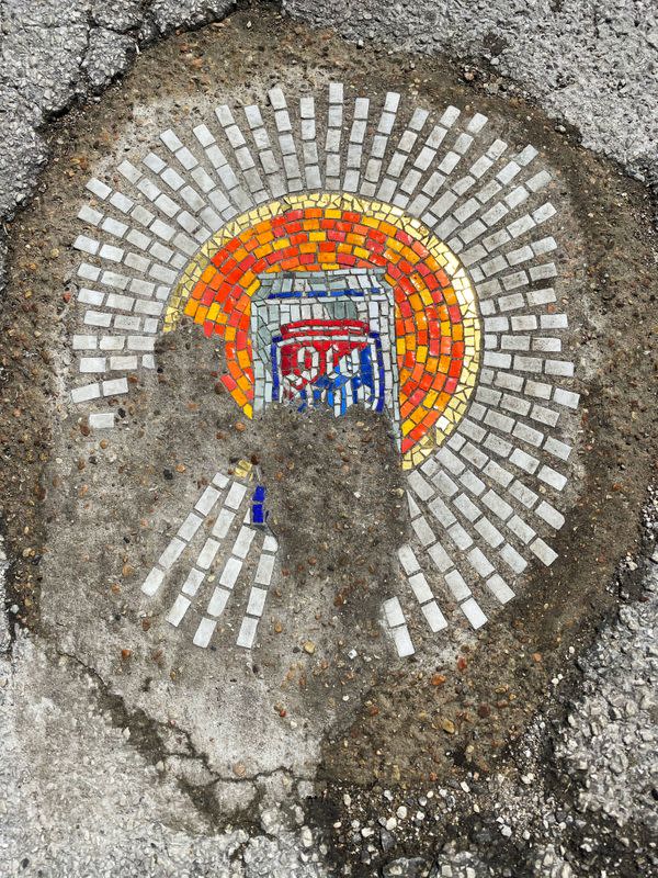 Chicago artist Jim Bachor creates four pandemic-themed pothole mosaics on the city's North Side