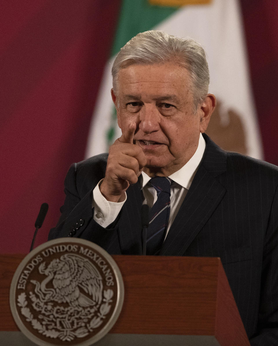 Mexican President Andres Manuel Lopez Obrador gives his daily, morning news conference at the presidential palace, Palacio Nacional, in Mexico City, Friday, Oct. 16, 2020. López Obrador said Friday that his ambassador to the United States told him two weeks ago that there was an investigation underway there involving Mexico's former defense secretary, retired Gen. Salvador Cienfuegos, who was arrested Thursday in Los Angeles. (AP Photo/Marco Ugarte)