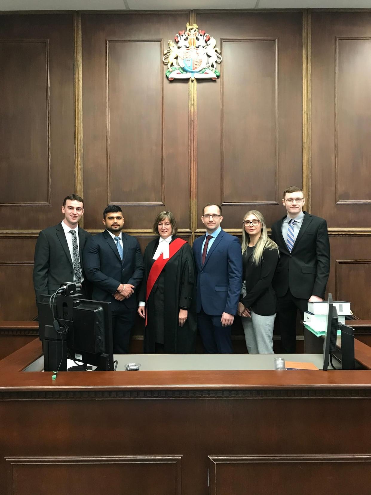 Shankey Dahiya, second from left, was sworn in as a police officer with the Greater Sudbury Police Service on March 27 along with Constables Cameron Lamour, Luc Paquin, Samantha Brosseau and Zachary Hosken. (Greater Sudbury Police Service/Facebook - image credit)