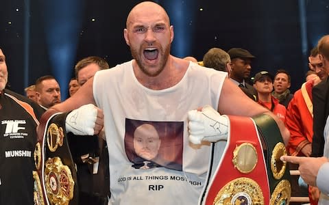 Tyson Fury with his belts in 2015 - Credit: AP