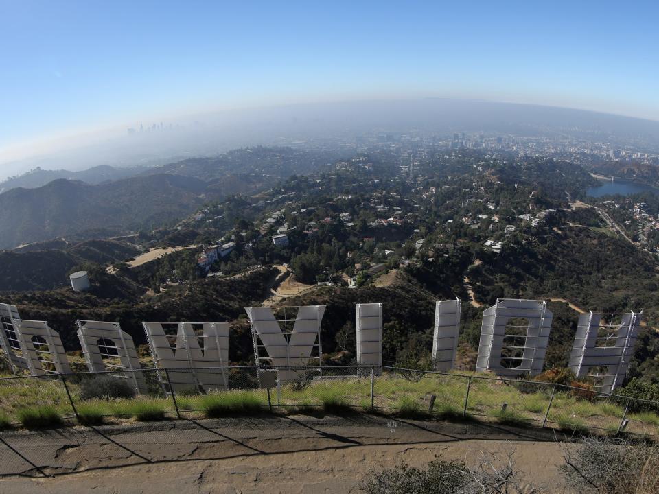 FILE PHOTO: Los Angeles is seen from behind the Hollywood sign in Los Angeles, California, U.S., August 14, 2019. REUTERS/Lucy Nicholson -/File Photo