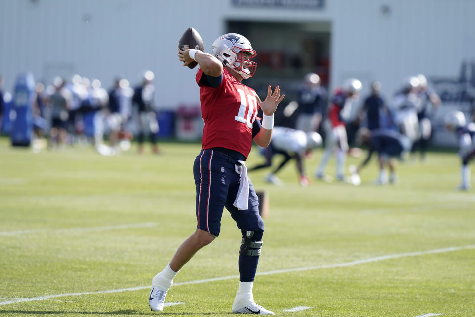 New England Patriots quarterback Mac Jones winds up to pass during an NFL football practice, Wednesday, Oct. 20, 2021, in Foxborough, Mass. (AP Photo/Steven Senne)