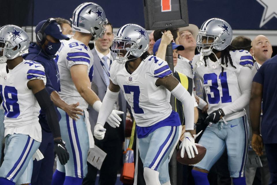 Dallas Cowboys' Trevon Diggs (7) celebrates intercepting a pass thrown by Washington Football Team's Taylor Heinicke in the first half of an NFL football game in Arlington, Texas, Sunday, Dec. 26, 2021. (AP Photo/Michael Ainsworth)