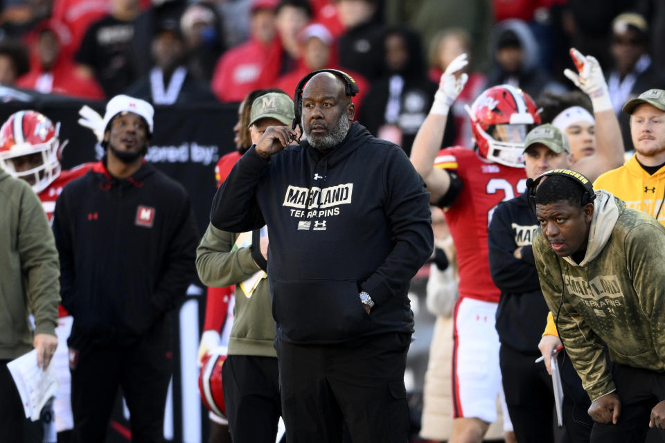 Maryland head coach Mike Locksley, center, looks on during the second half of an NCAA college football game against Michigan, Saturday, Nov. 18, 2023, in College Park, Md. Michigan won 31-24. (AP Photo/Nick Wass)