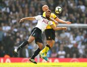 <p>Mousa Dembele is denied by Nordin Amrabat </p>