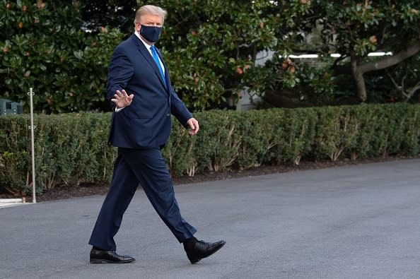 US President Donald Trump waves as he walks to Marine One prior to departure from the South Lawn of the White House in Washington, DC.