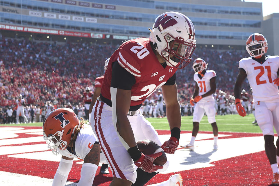 Wisconsin running back Isaac Guerendo (20) celebrates scoring a touchdown against Illinois during the first half of an NCAA college football game Saturday, Oct. 1, 2022, in Madison, Wis. (AP Photo/Kayla Wolf)
