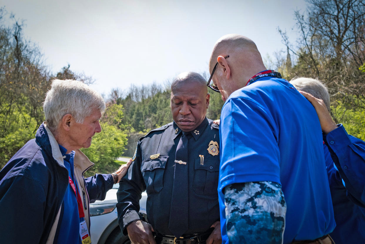 Chief of Police John Drake is prayed for at the entrance of The Covenant School on March 28, 2023 in Nashville, Tenn. (Seth Herald / Getty Images)