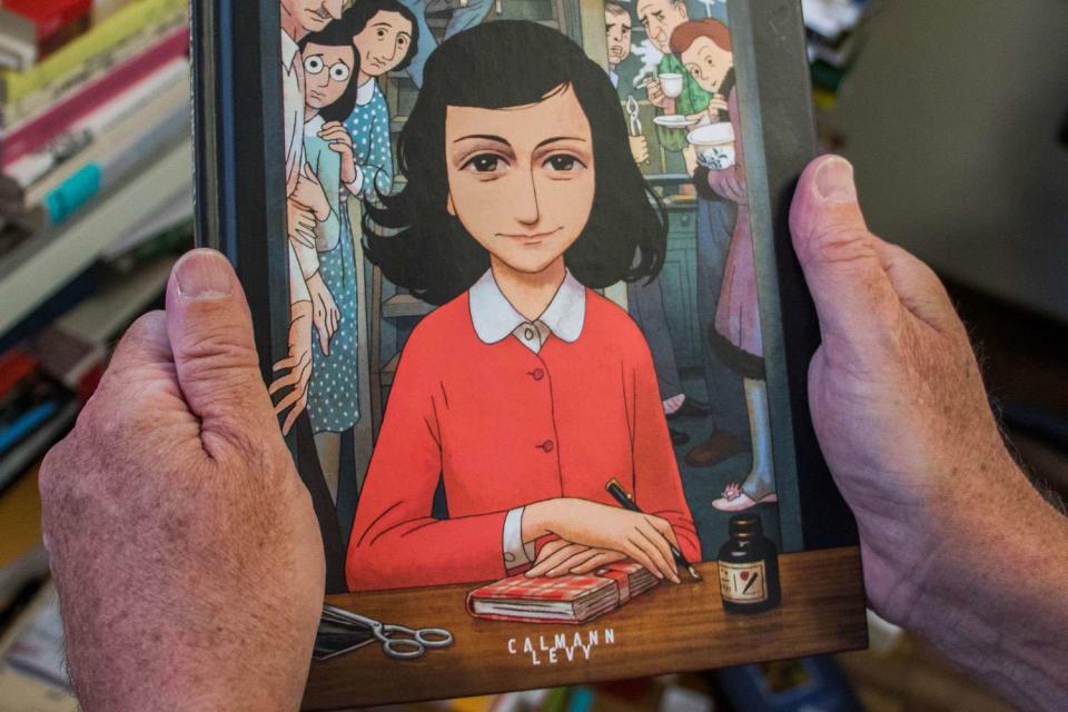 <p>STRINGER/AFP via Getty</p> The graphic novel version of "The Diary of Anne Frank."