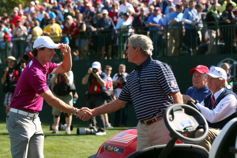 MEDINAH, IL - SEPTEMBER 29:  Former U.S. President George W. Bush (C) greets Rory McIlroy of Europe as George H.W. Bush looks on during day two of the Afternoon Four-Ball Matches for The 39th Ryder Cup at Medinah Country Club on September 29, 2012 in Medinah, Illinois.  (Photo by Mike Ehrmann/Getty Images)