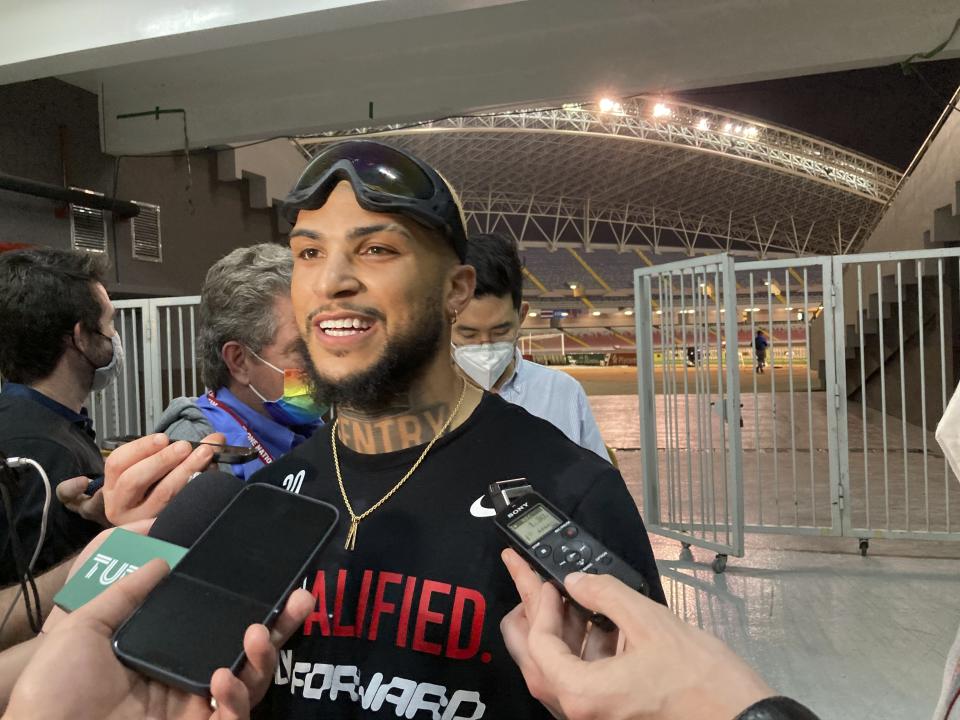 DeAndre Yedlin speaks to reporters Wednesday, March 30, 2022, in San Jose, Costa Rica, after the United States clinched a berth in the 2022 soccer World Cup despite a 2-0 loss to Costa Rica on the last night of qualifying. Yedlin is one of four players on the team Wednesday who were on the team for a 2017 loss in Trinidad that eliminated the U.S. that year. (AP Photo/Ron Blum)