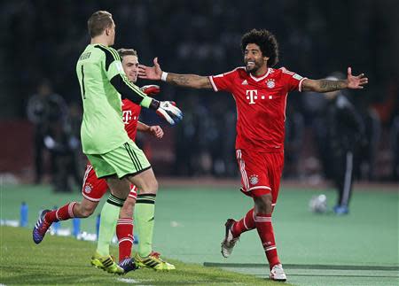 Dante (R) of Germany's Bayern Munich celebrates his goal against Morocco's Raja Casablanca during their 2013 FIFA Club World Cup final match at Marrakech stadium December 21, 2013. REUTERS/Louafi Larbi