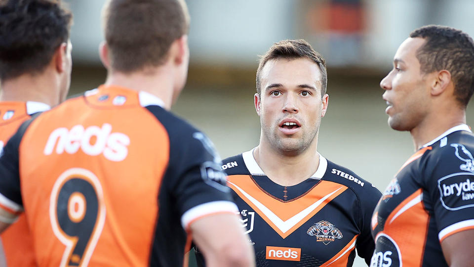 Seen here, Wests Tigers halfback Luke Brooks looks on in frustration during an NRL game.