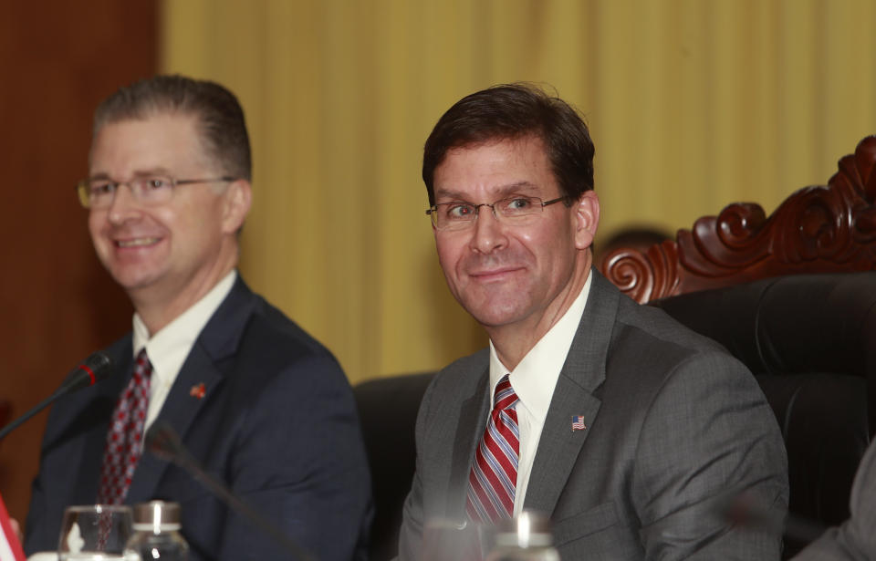 U.S. Defense Secretary Mark Esper, right, and U.S. Ambassador to Hanoi Daniel Kritenbrink prepare before a meeting with Vietnamese Defense Minister Ngo Xuan Lich in Hanoi, Vietnam Wednesday, Nov. 20, 2019. Esper is on a visit to Vietnam to strengthen the military relations with the Southeast Asian nation. (AP Photo/Hau Dinh)