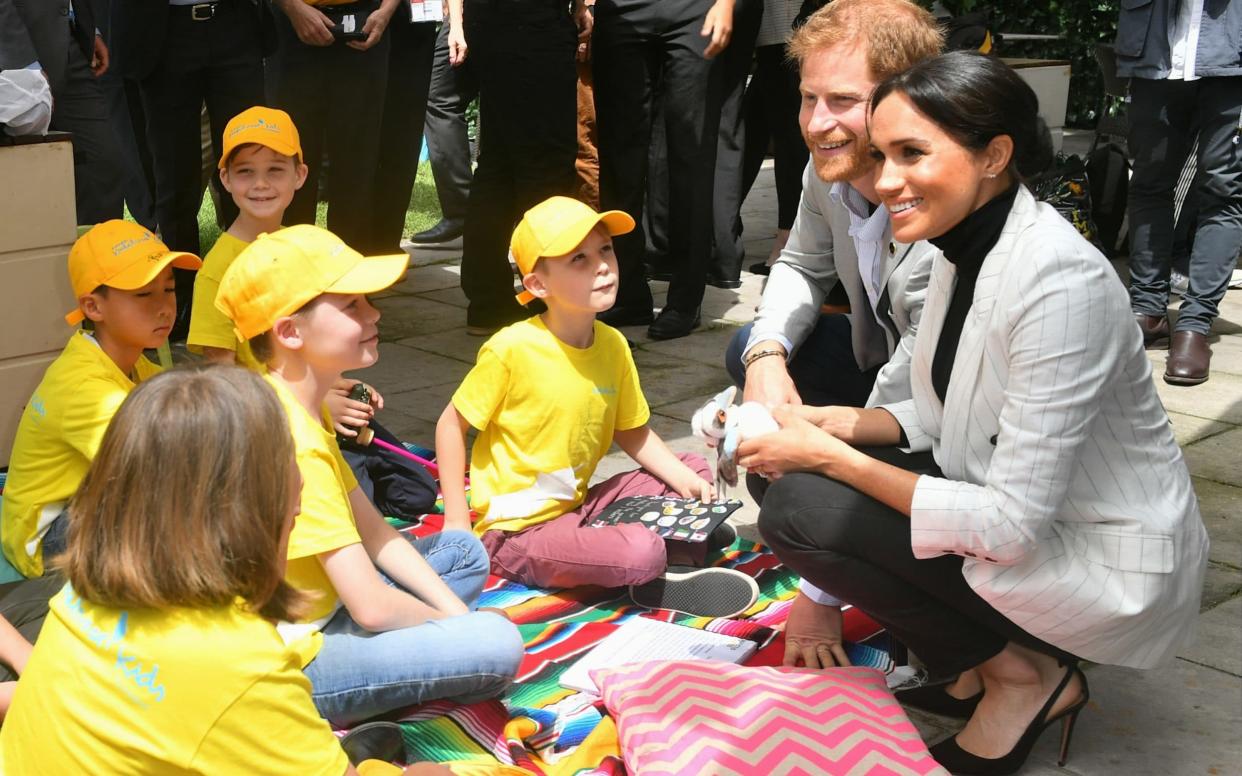 The Duchess of Sussex caught up with Prince Harry for the second event of the day, a reception for children hosted by the Australian Prime Minister - WireImage