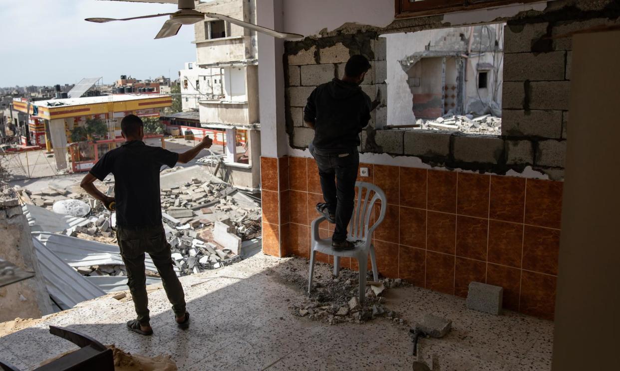 <span>A Palestinian restores his home in Khan Younis after Israeli forces withdrew from the southern Gaza Strip.</span><span>Photograph: Haitham Imad/EPA</span>