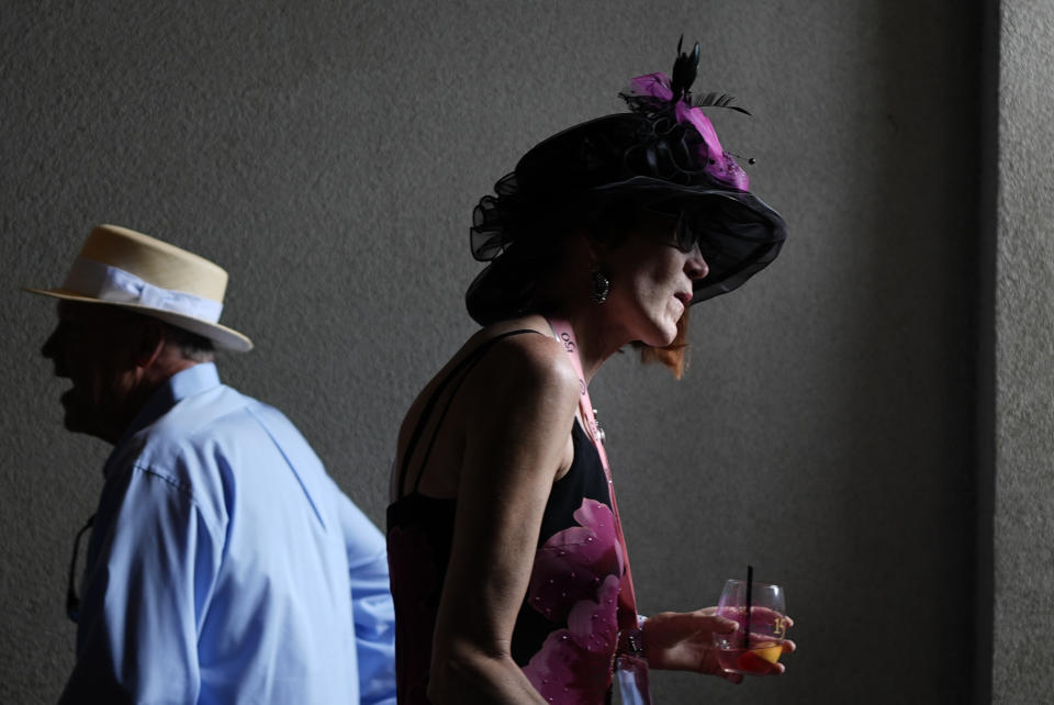 Race fans walk though the stands at Churchill Downs before the 150th running of the Kentucky Derby horse race Saturday, May 4, 2024, in Louisville, Ky. (AP Photo/Brynn Anderson)