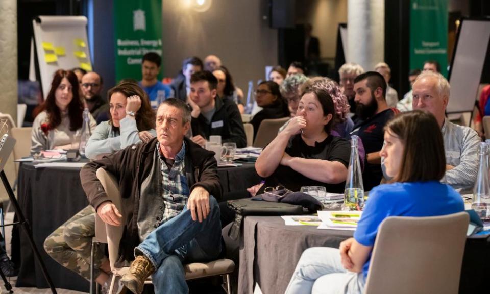 Members of the citizens' climate assembly listen to a presentation