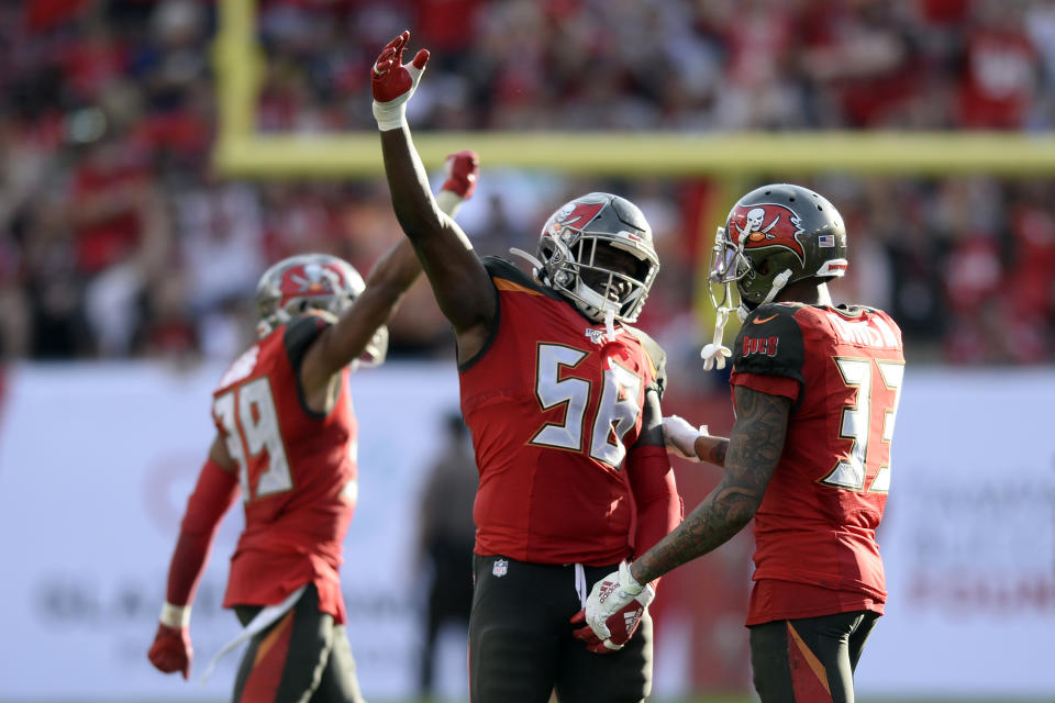 Tampa Bay Buccaneers linebacker Shaquil Barrett (58) celebrates with cornerback Carlton Davis (33) at Barrett sacked Atlanta Falcons quarterback Matt Ryan during the second half of an NFL football game Sunday, Dec. 29, 2019, in Tampa, Fla. (AP Photo/Jason Behnken)