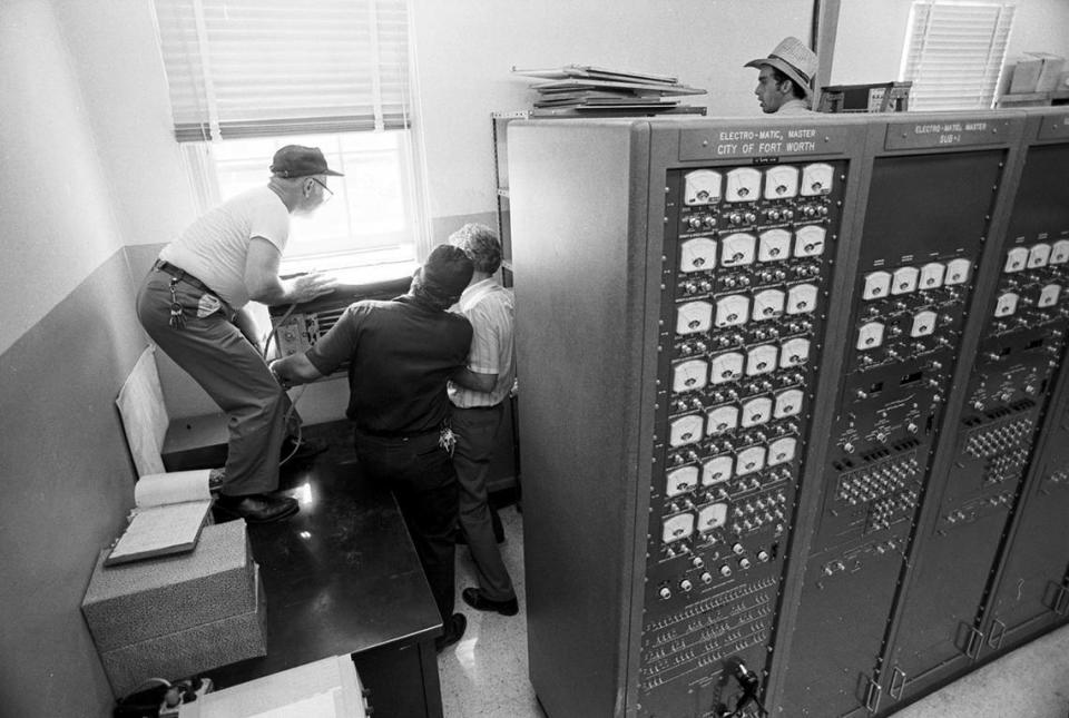 July 3, 1980: Maintenance workers in the Fort Worth Fire Department dispatch office work on repairing the air conditioning during a heat wave. Ron T. Ennis/Fort Worth Star-Telegram archive/UT Arlington Special Collections