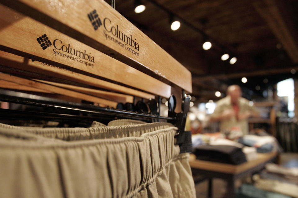A customer shops at the Columbia Sportswear flagship store in Portland, Oregon April 26, 2007. Outerwear maker Columbia Sportswear said on Thursday that quarterly net profit rose 34 percent, above analysts' estimates, but a disappointing full-year sales and earnings outlook and lower-than-expected fall orders sent shares down nearly 6 percent. REUTERS/Richard Clement (UNITED STATES)