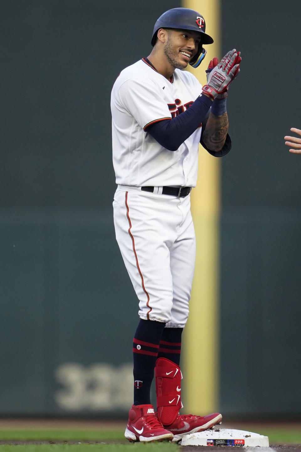 Minnesota Twins' Carlos Correa celebrates after hitting a single against the Kansas City Royals during the first inning of a baseball game Tuesday, Aug. 16, 2022, in Minneapolis. (AP Photo/Abbie Parr)