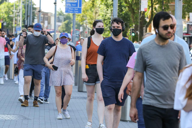 People wearing face masks as a precaution against the spread of covid-19 seen outside Tottenham Hotspur Stadium in north London to receive their Covid-19 vaccine during a mass vaccination event, as UK Covid-19 vaccination drive continues. (Photo by Steve Taylor / SOPA Images/Sipa USA)