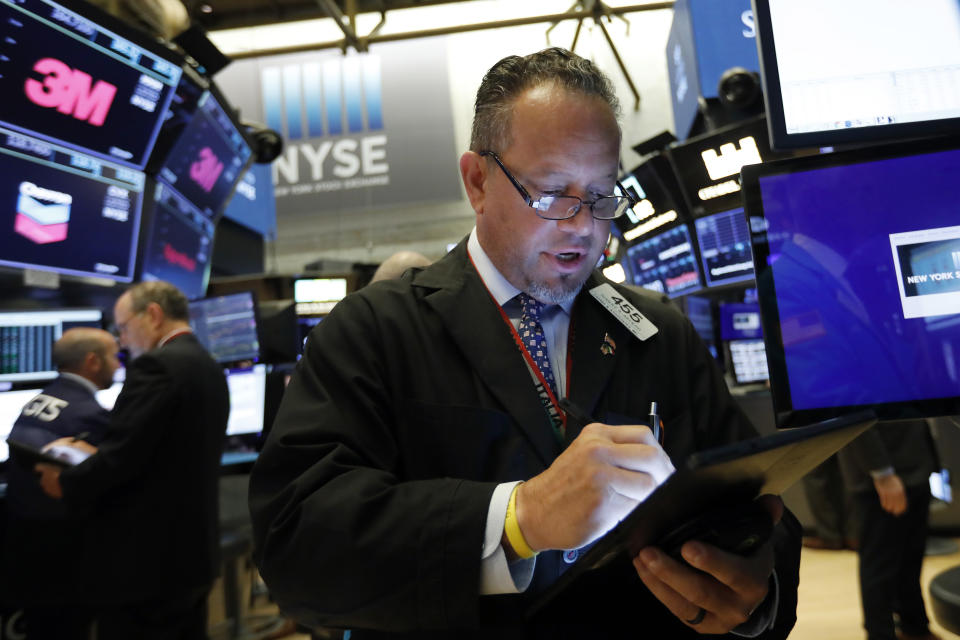 Trader Robert Arciero works on the floor of the New York Stock Exchange, Tuesday, Aug. 6, 2019. Stock markets turned higher on Tuesday as China stabilized its currency after allowing it to depreciate against the dollar in response to President Donald Trump's decision to put more tariffs on Chinese goods. (AP Photo/Richard Drew)