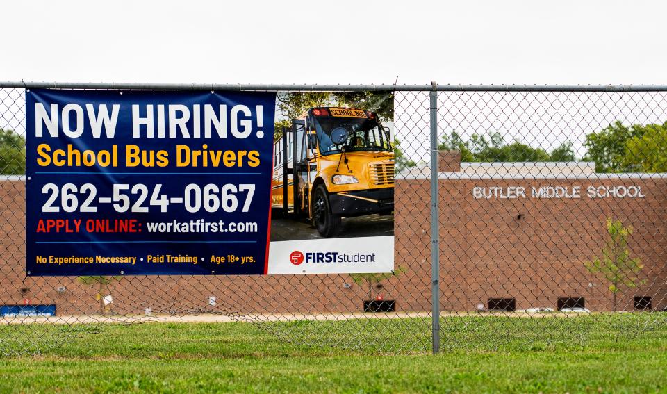 A hiring banner is seen outside Butler Middle School as a bus driver shortage has caused some Waukesha students to not get picked up until after school starts on Thursday September 7, 2023 at in Waukesha, Wis.