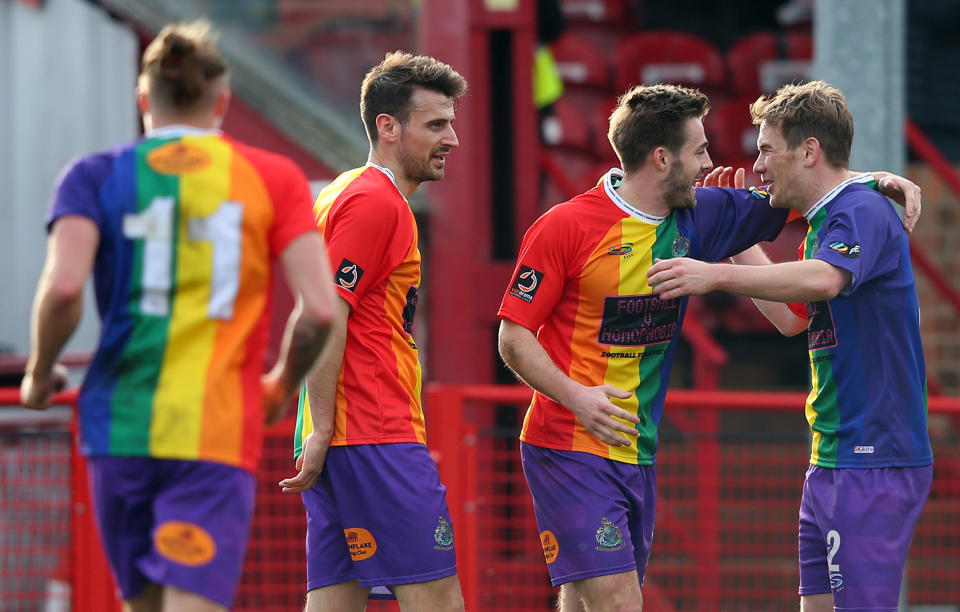 Altrincham players celebrate a goal scored by Josh Hancock (second from right) against Bradford AFC on Saturday. (Getty)